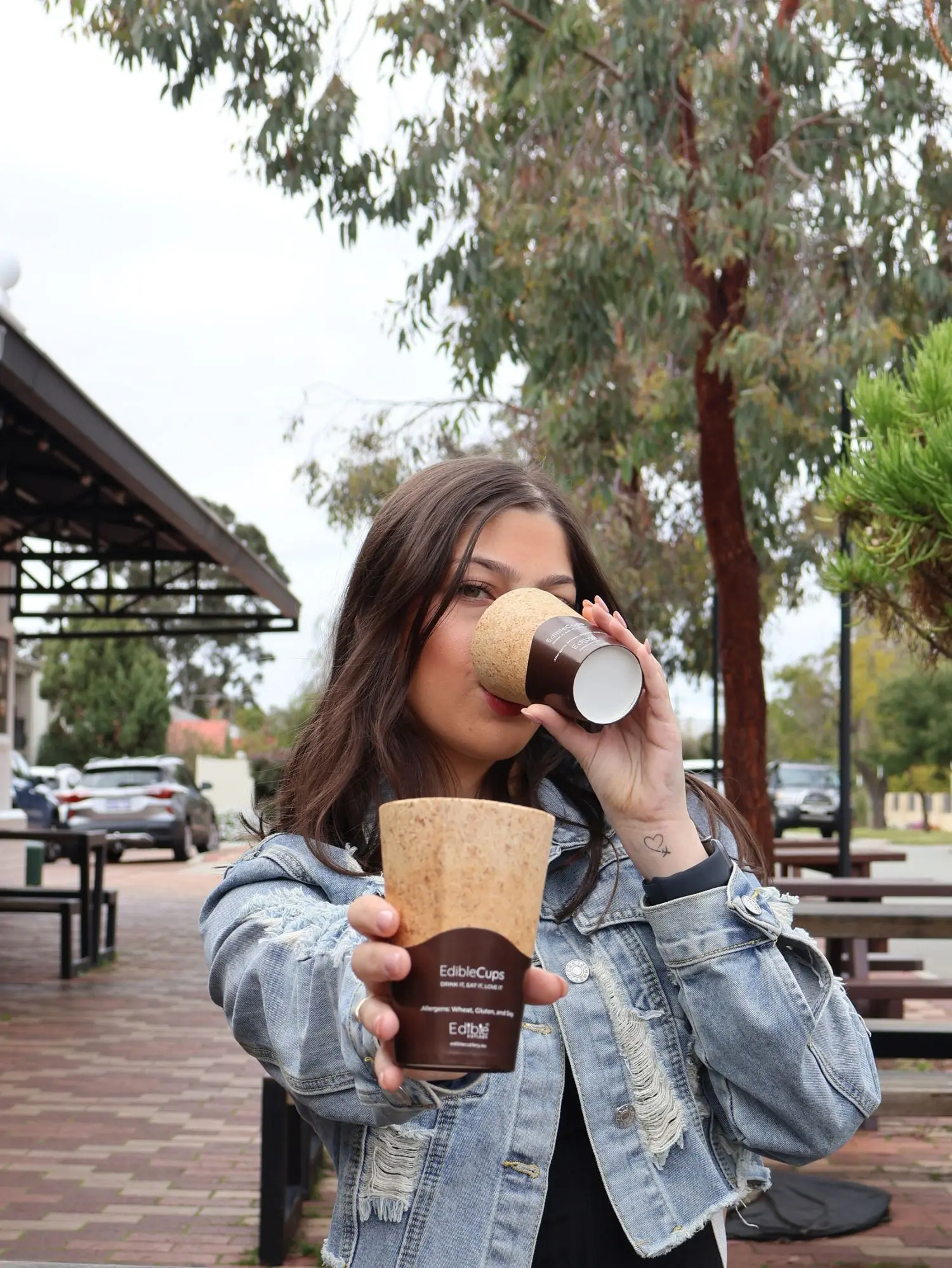 woman-drinking-coffee-ediblecup-outdoors